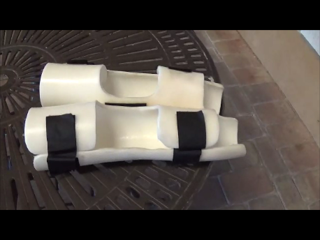 A moulded knee orthosis photographed against a plain background