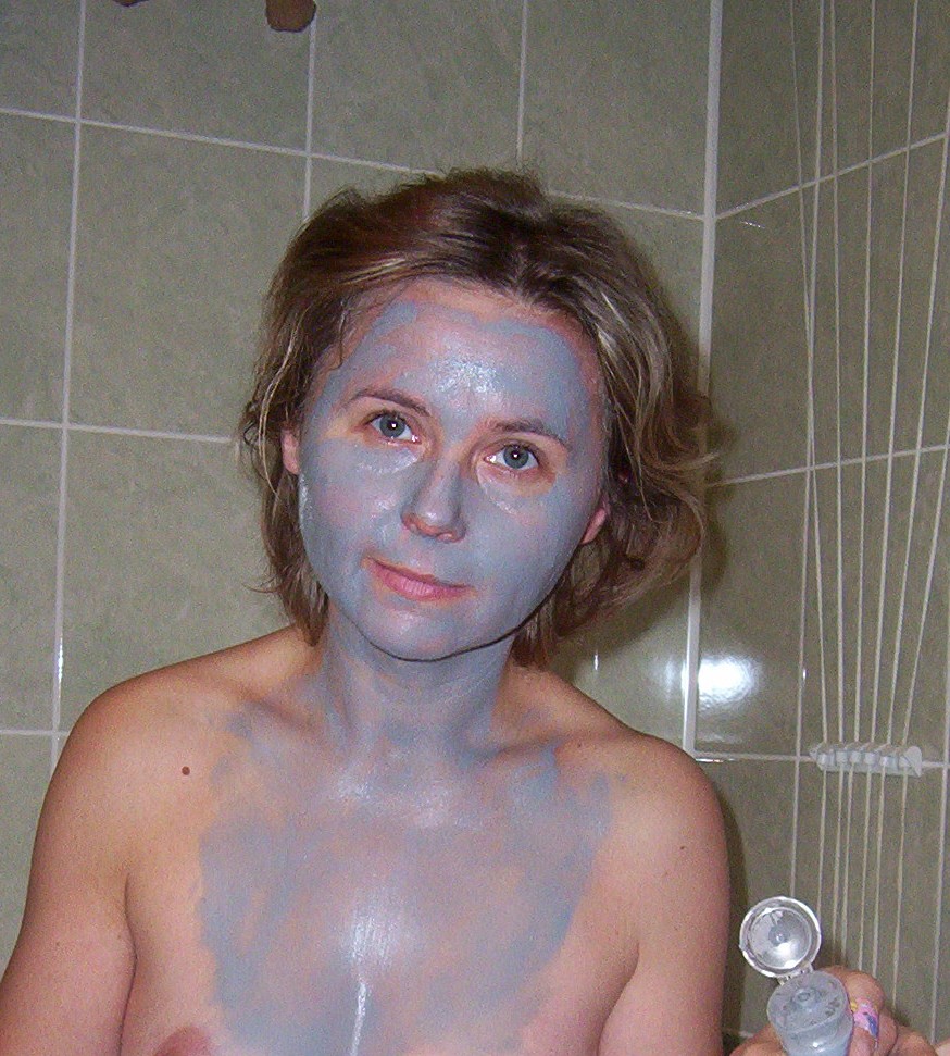 A cut sheet mask shaped to fit the decolletage, lying on the skin