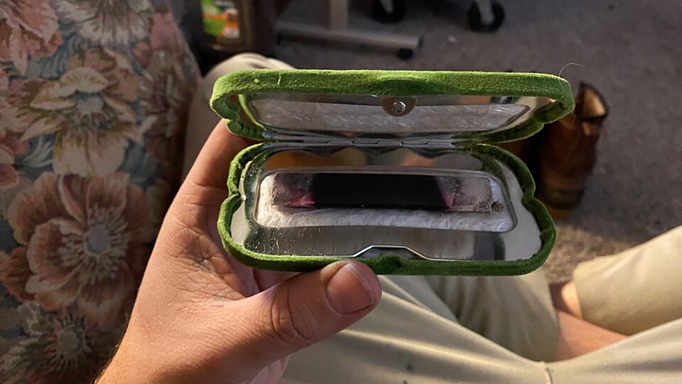 A pocket hand warmer opened to show the filling inside